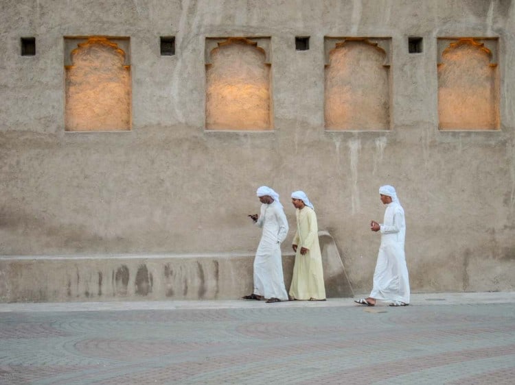 Men walking outside Sheikh Saeed Al Maktoum House