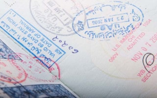 Dubai UAE visa and immigration stamps in a passport