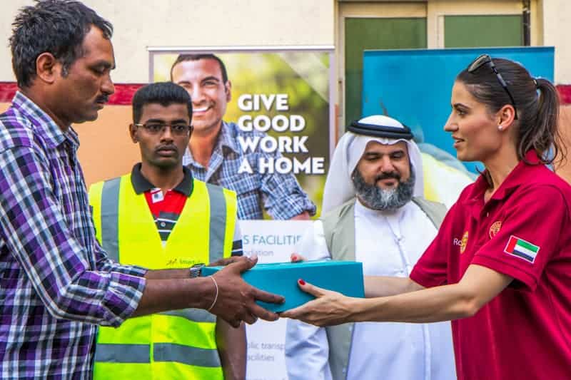 Food package being given to a worker in Dubai during Ramadan