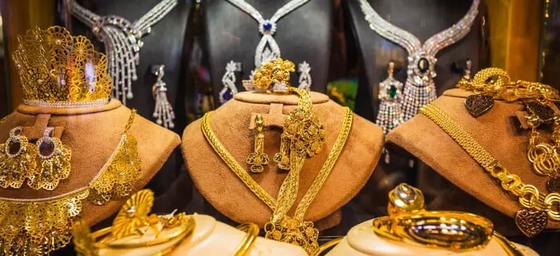 Gold chains, necklaces, bangles, and other items of jewellery on display in Gold Souk in Dubai.