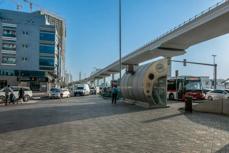 Bus stop outside ADCB Metro Station in Dubai and 61 bus service from Al Ghubaiba Bus Station to Ras Al Khor