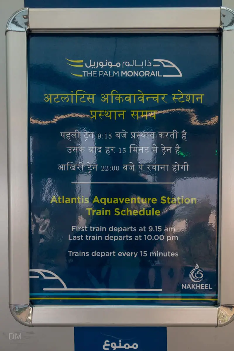 Sign at Atlantis Aquaventure Station showing departure times of first and last trains of Dubai Monorail
